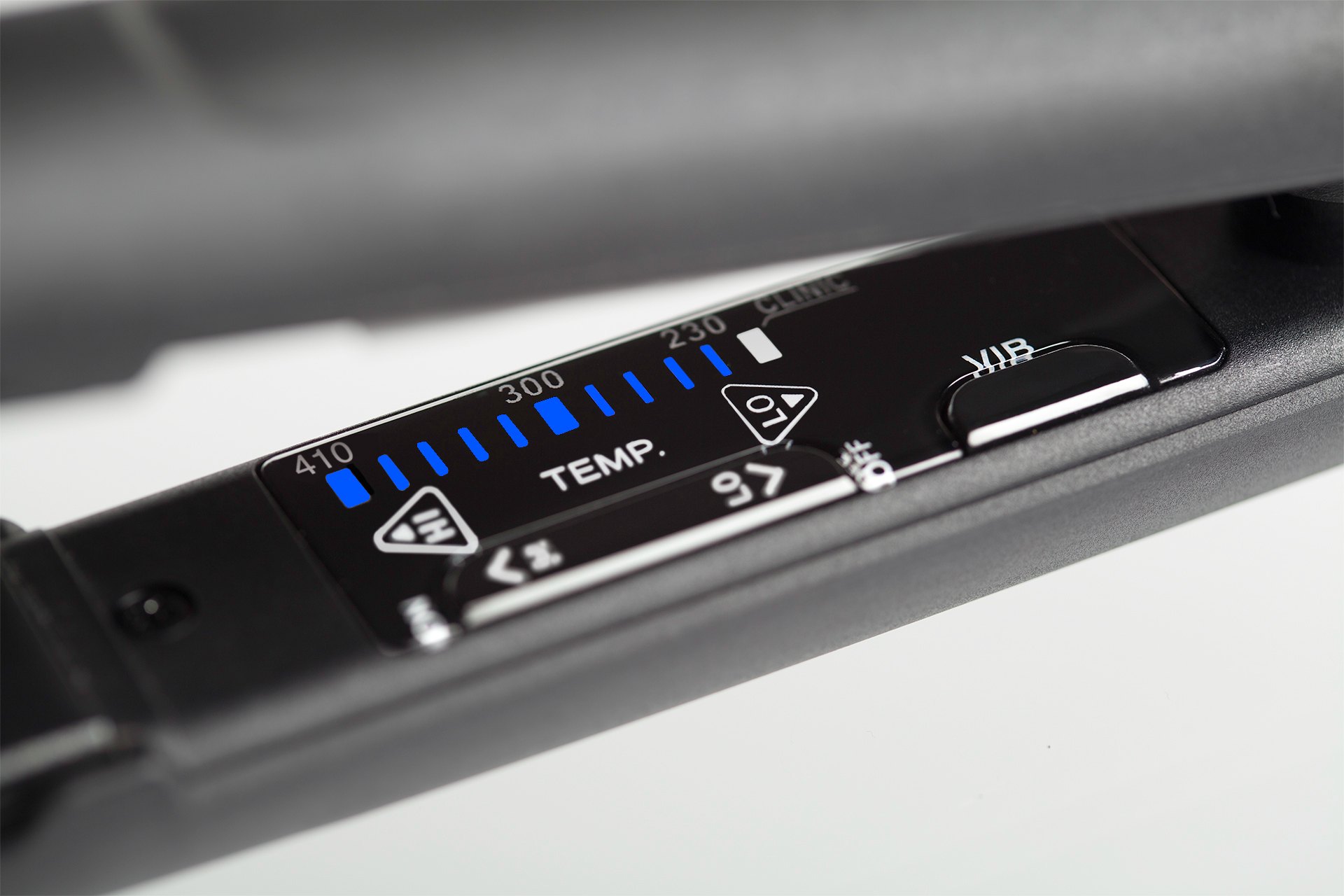 Close-up of the Evan iron’s digital LED temperature display, showing blue heat settings from 230 to 410 degrees
